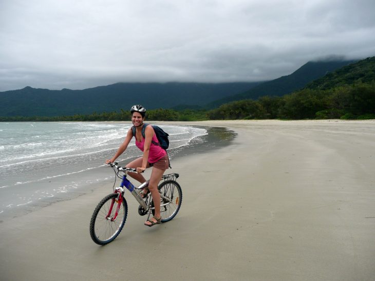 Clare cycling along the beach at Cape Tribulation