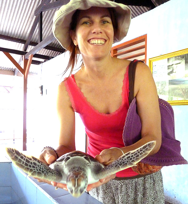 Brave Clare holding a turtle