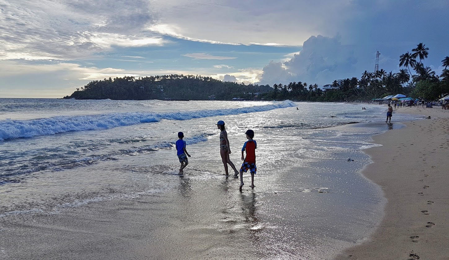 playing on the beach in Mirissa, Sri Lanka